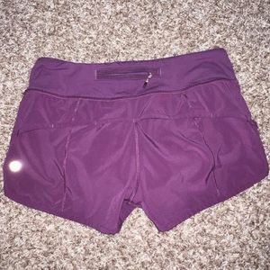 Purple Lululemon shorts, running